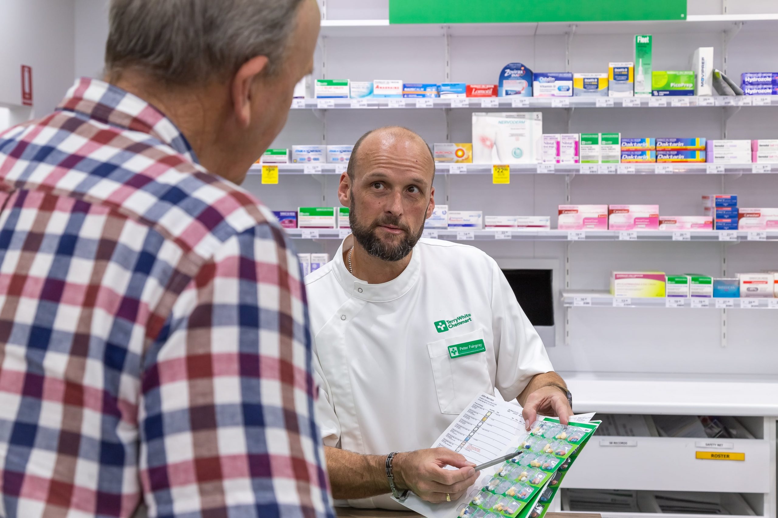 TerryWhite Chemmart pharmacist with a customer
